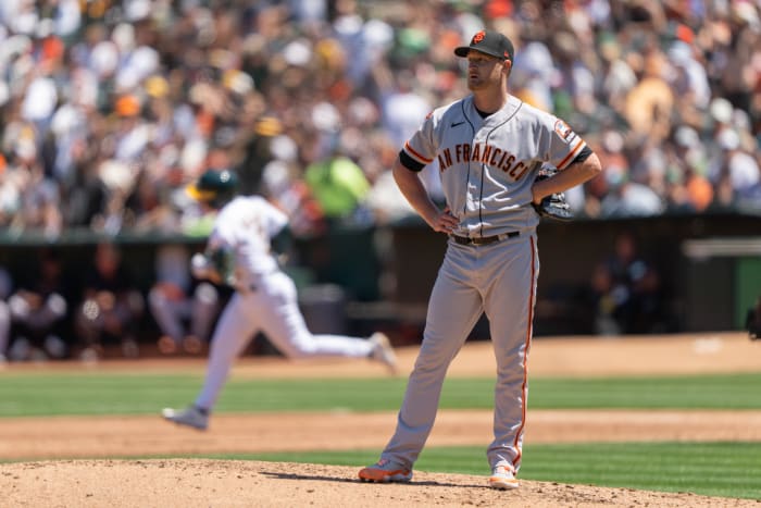 Aug 6, 2023; Oakland, California, USA; San Francisco Giants starting pitcher Alex Cobb (38) reacts as Oakland Athletics shortstop Nick Allen (2) runs the bases after hitting a two-run home run during the second inning at Oakland-Alameda County Coliseum.